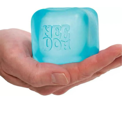 Hand holding Nee Doh Nice Ice Baby blue squishy cube - pocket-size stress relief fidget toy